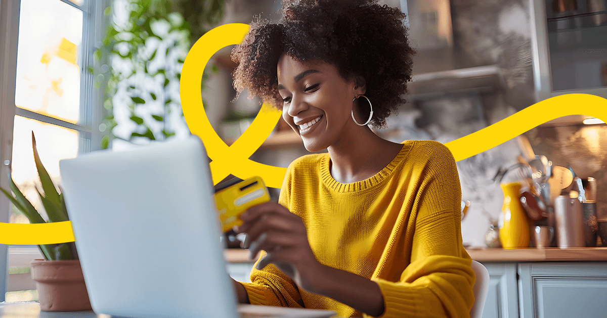 Women entering her credit card information on her computer to sign up for a subscription